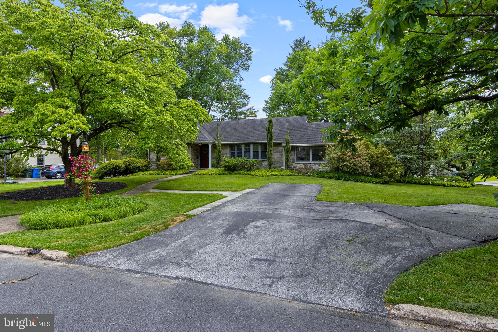 413 Hawthorne Road Wallingford, PA 19086 - Photo 45 of 52 a front view of a house with garden