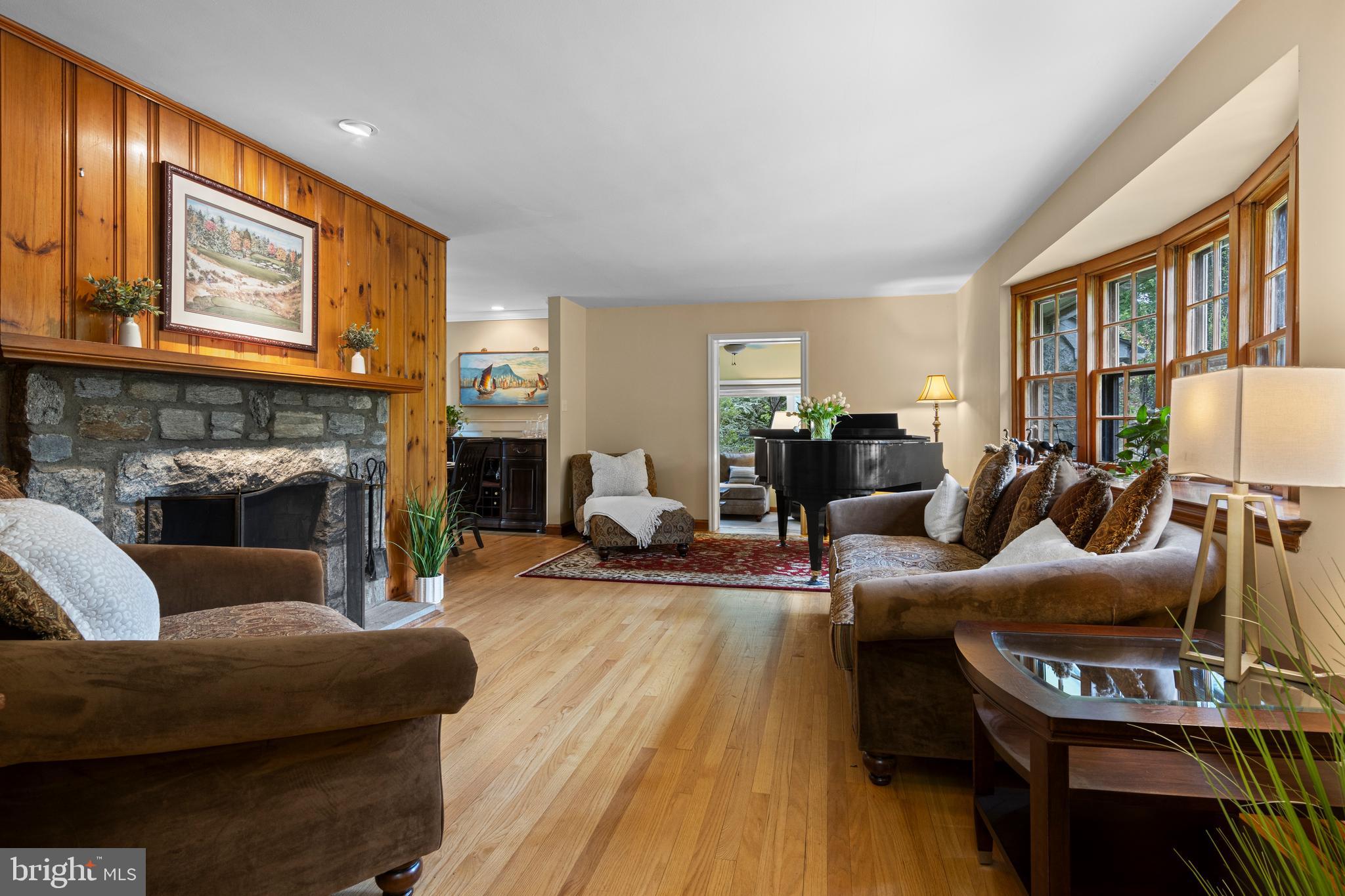 413 Hawthorne Road Wallingford, PA 19086 - Photo 6 of 52 a living room with furniture and a fireplace