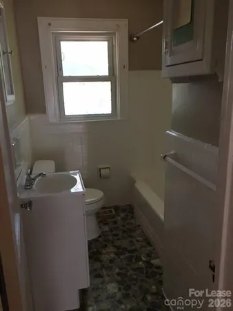 a bathroom with a sink and toilet