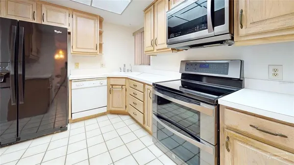 a view of a dining room with furniture large windows and wooden floor