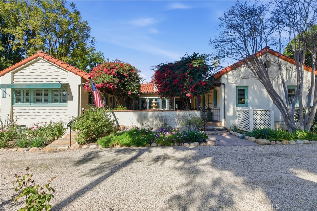 2855 McAllister Street Riverside, CA 92503 - Photo 12 of 75 a front view of a house with a yard and a garage
