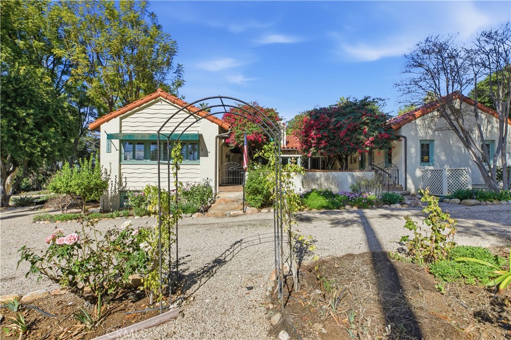 2855 McAllister Street Riverside, CA 92503 - Photo 15 of 75 a front view of a house with a yard and potted plants