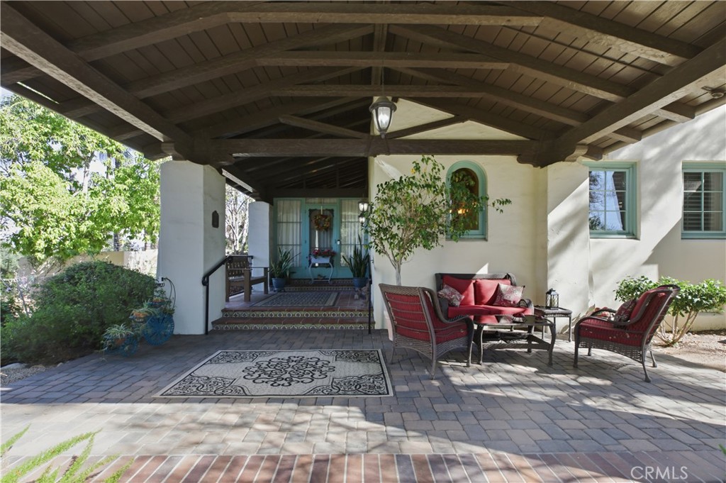 2855 McAllister Street Riverside, CA 92503 - Photo 21 of 75 a view of a porch with furniture and a yard