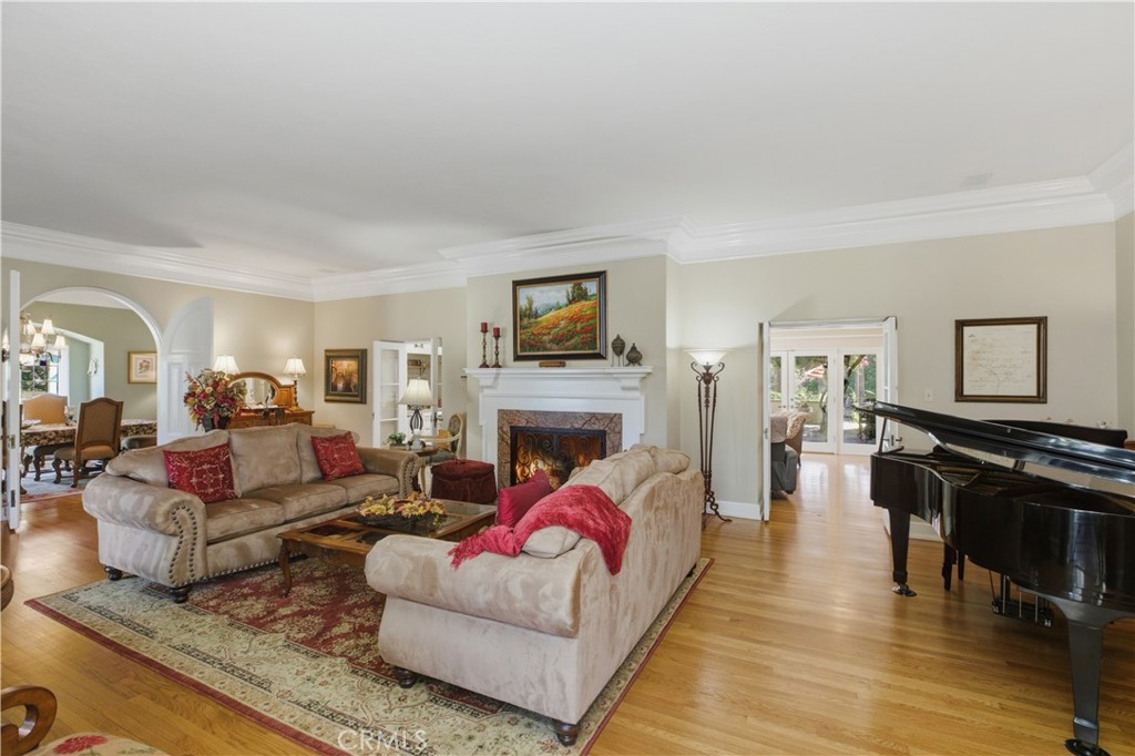 2855 McAllister Street Riverside, CA 92503 - Photo 27 of 75 a living room with fireplace furniture and a wooden floor