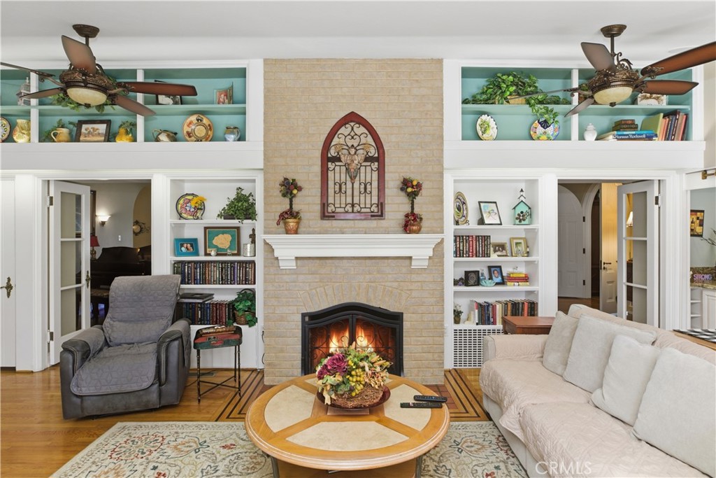 2855 McAllister Street Riverside, CA 92503 - Photo 33 of 75 a living room with furniture a fireplace and a large window