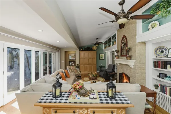 a view of a house with a yard patio and a garden