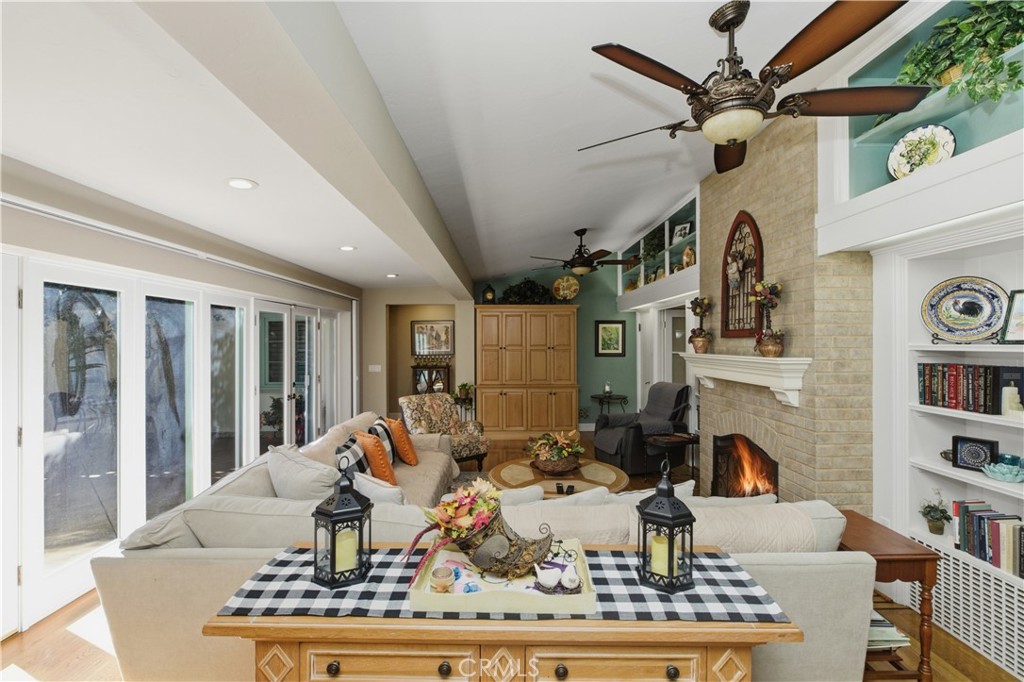 2855 McAllister Street Riverside, CA 92503 - Photo 34 of 75 a living room with furniture a fireplace and a large window