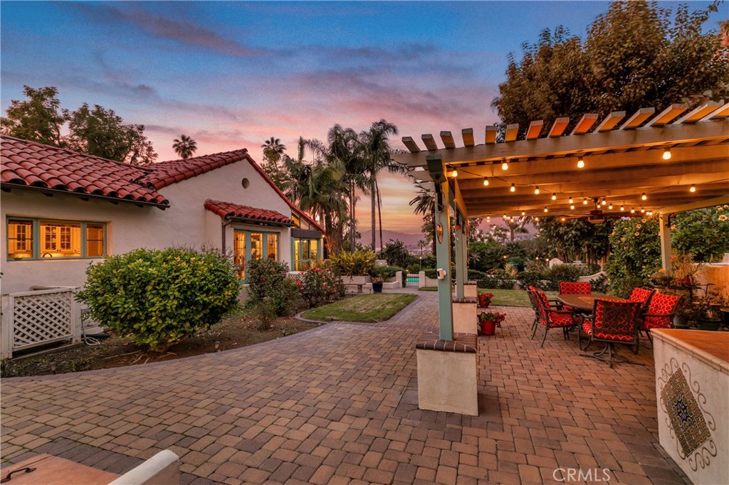 2855 McAllister Street Riverside, CA 92503 - Photo 72 of 75 a view of a patio with couches and table and chairs and potted plants