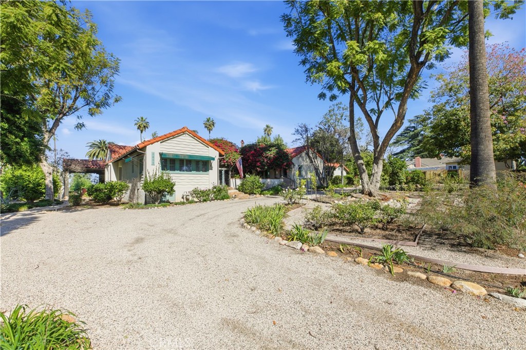 2855 McAllister Street Riverside, CA 92503 - Photo 9 of 75 a front view of a house with a yard and garage