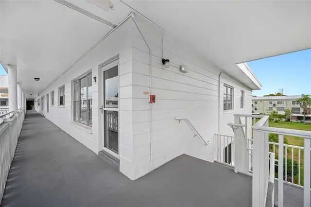 a view of a hallway with white walls