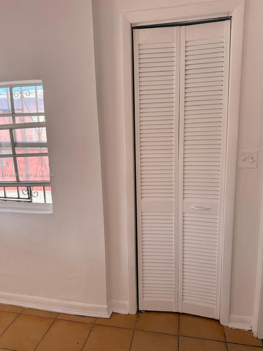409 Northwest 33rd Street, Unit 1 Miami, FL 33127 - Photo 11 of 17 a view of a room that has a window