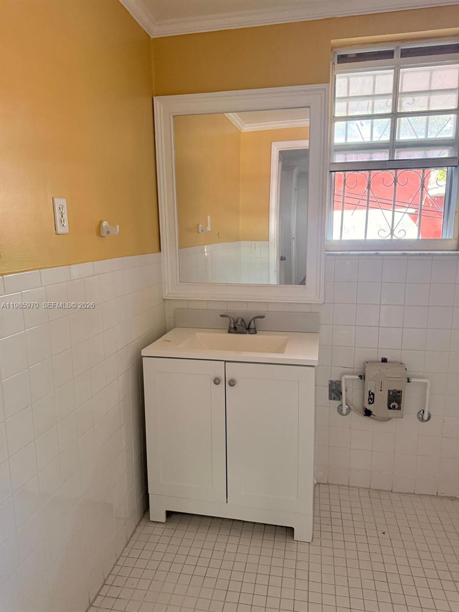 409 Northwest 33rd Street, Unit 1 Miami, FL 33127 - Photo 13 of 17 a utility room with a sink dryer and washer