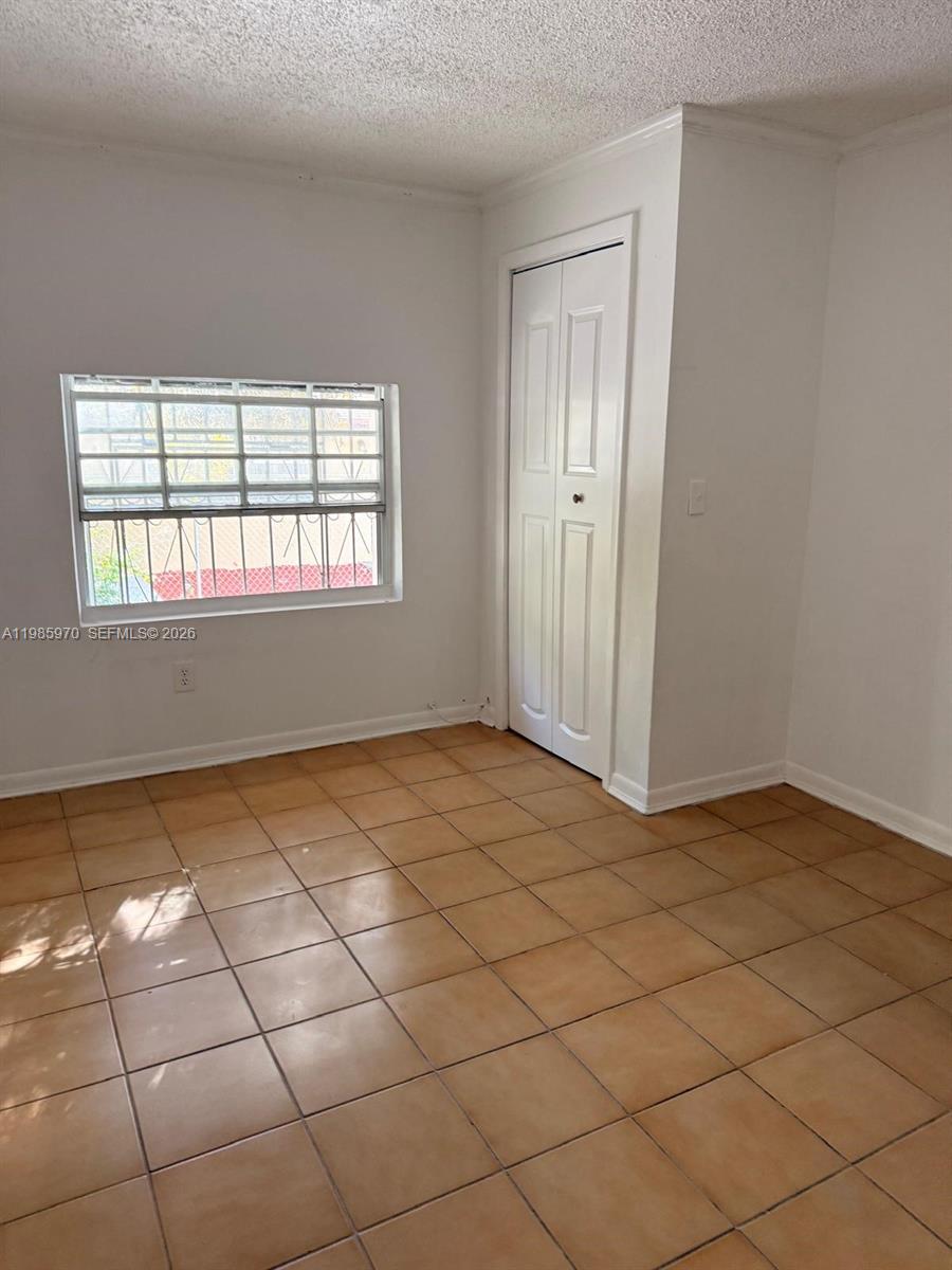 409 Northwest 33rd Street, Unit 1 Miami, FL 33127 - Photo 15 of 17 a view of an empty room and window