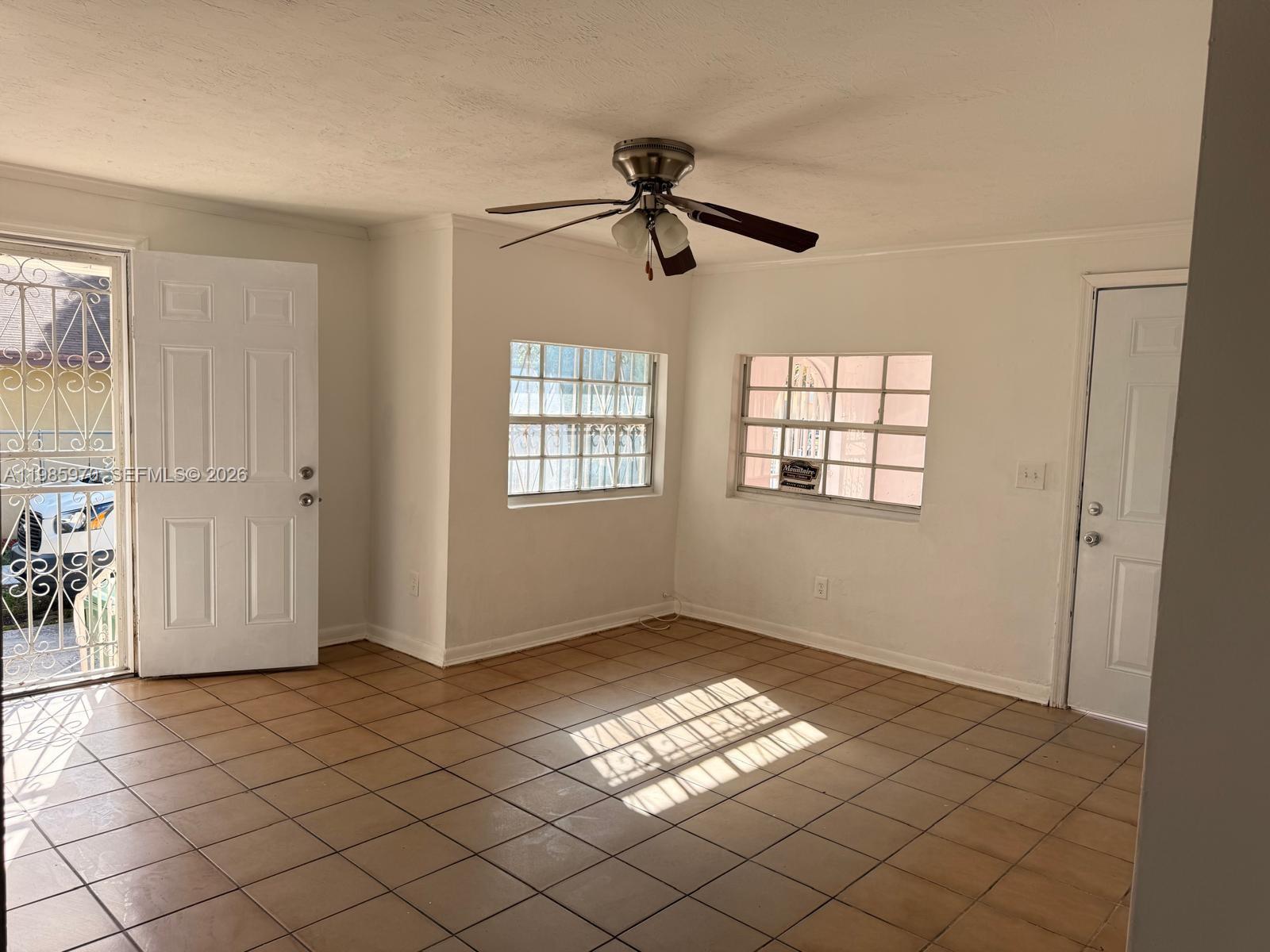 409 Northwest 33rd Street, Unit 1 Miami, FL 33127 - Photo 2 of 17 a view of empty room with windows