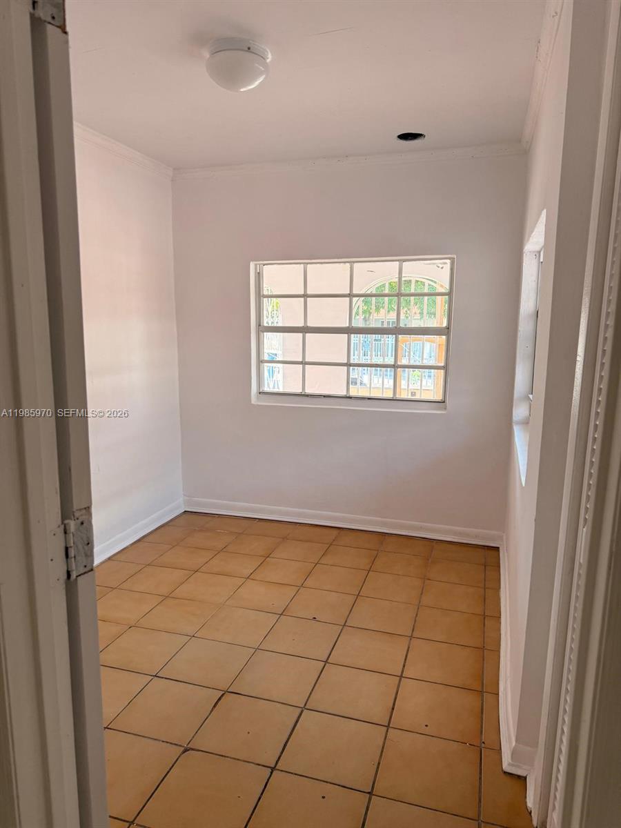 409 Northwest 33rd Street, Unit 1 Miami, FL 33127 - Photo 3 of 17 a view of an empty room and window