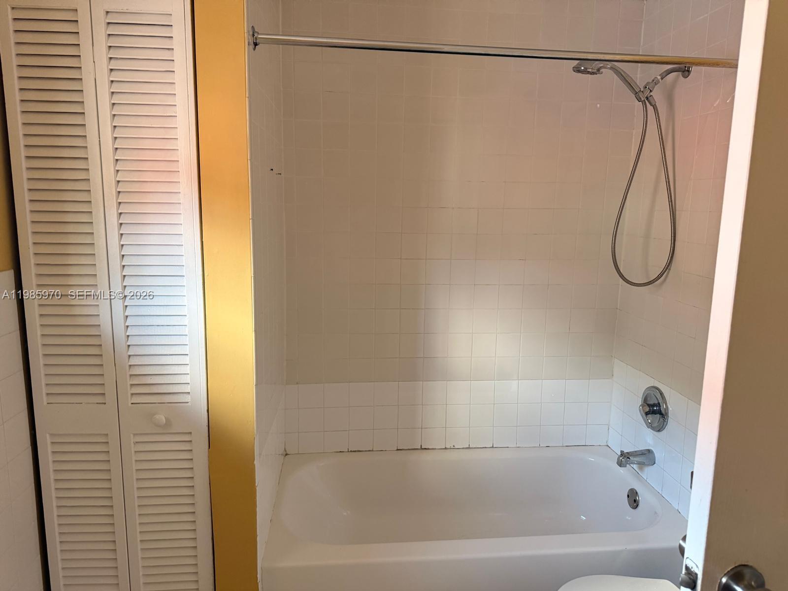 409 Northwest 33rd Street, Unit 1 Miami, FL 33127 - Photo 9 of 17 a bathroom with a shower and a bath tub