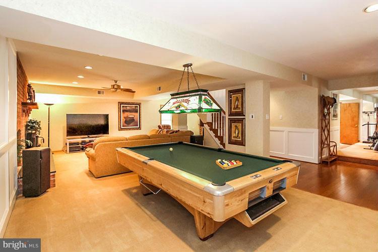 20801 Layton Ridge Drive Gaithersburg, MD 20882 - Photo 22 of 30 a living room with a pool table and a couch