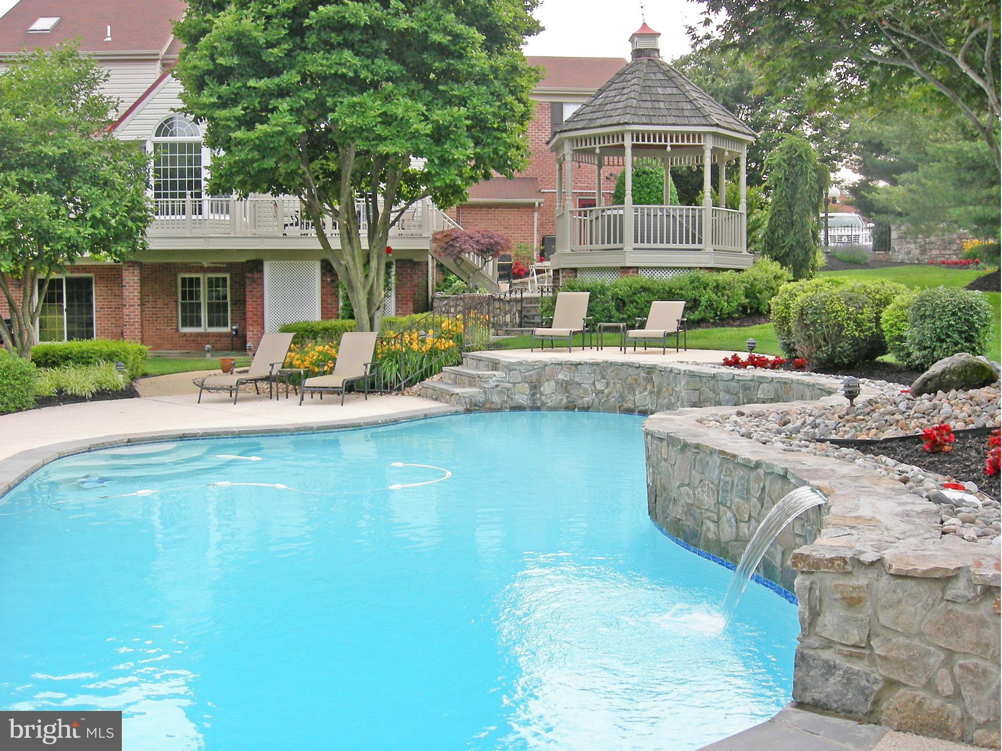 20801 Layton Ridge Drive Gaithersburg, MD 20882 - Photo 28 of 30 a front view of a house with swimming pool and porch