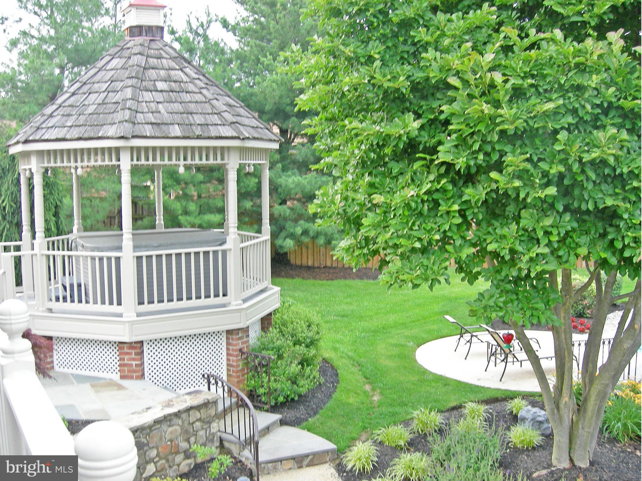 20801 Layton Ridge Drive Gaithersburg, MD 20882 - Photo 29 of 30 a view of a house with a yard and furniture