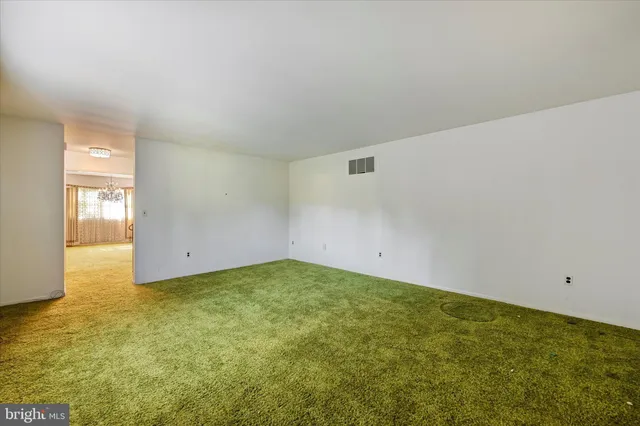 a view of a hallway with a chandelier