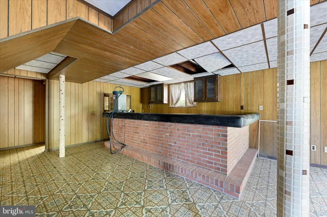 a view of an house with backyard space and balcony