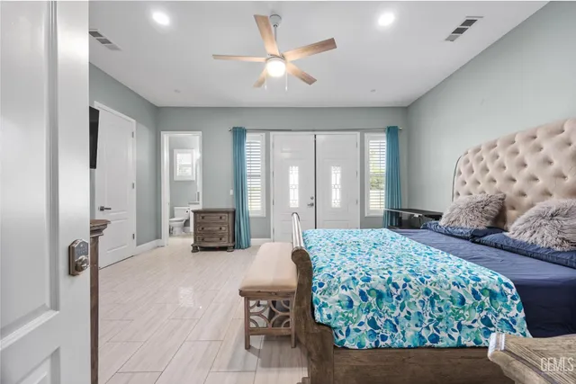 a swimming pool with an outdoor space and seating area