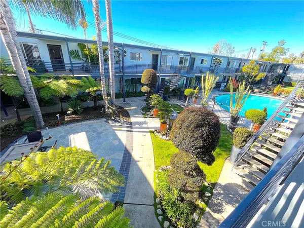 a view of a backyard with sitting area