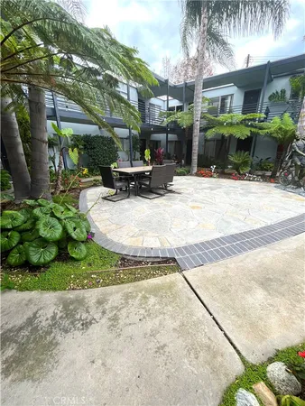 a view of a fountain in front of a house