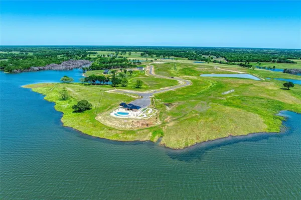 a roof deck with table and chairs a barbeque