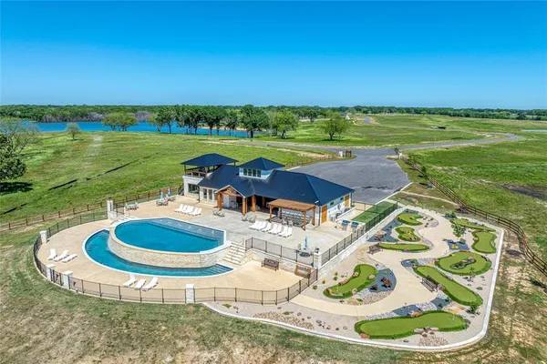 a view of a swimming pool with an outdoor seating