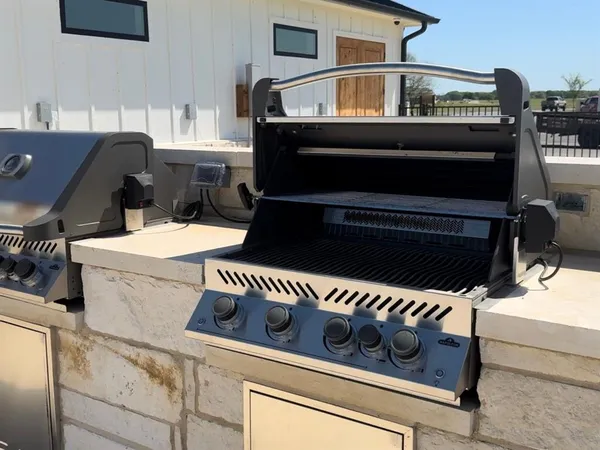 an aerial view of a swimming pool with a yard