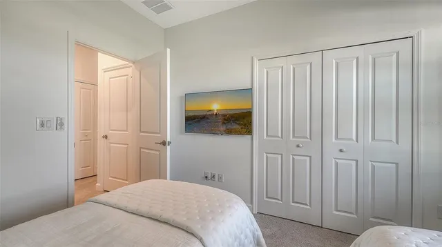 a view of a patio with table and chairs under an umbrella