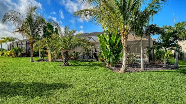 a view of a tennis ground with a large swimming pool