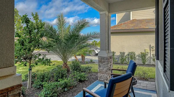 a living room with a baby crib and a window