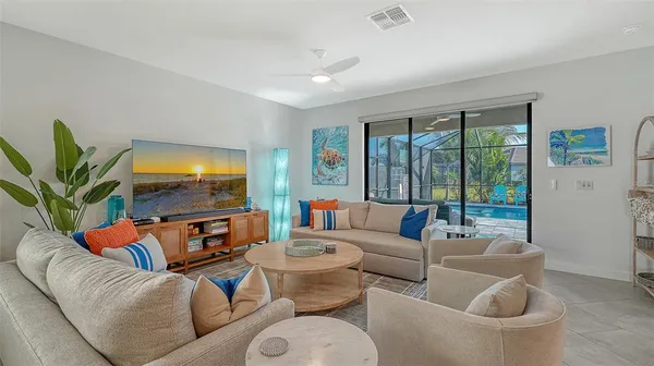 a view of a dining room with furniture and chandelier