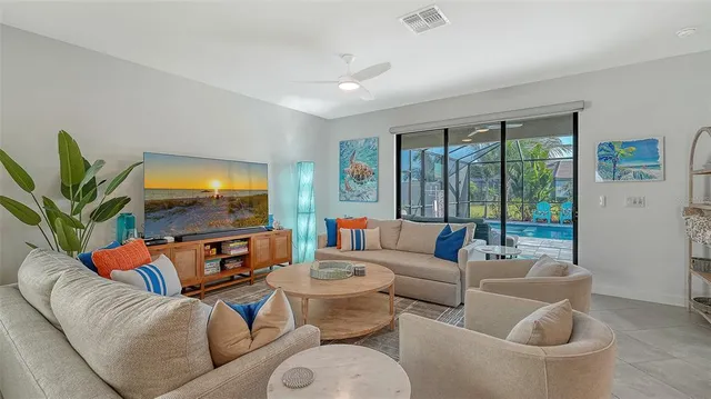 a view of a dining room with furniture and chandelier