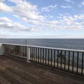 a view of balcony with wooden floor