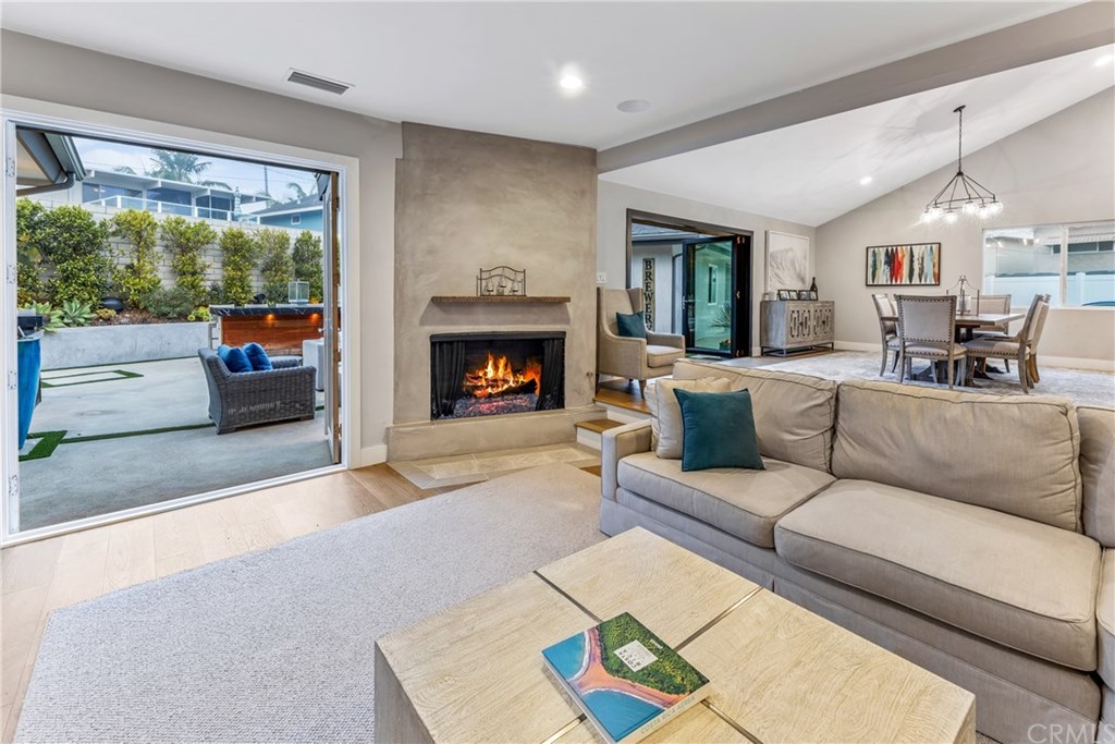 720 Sandpiper Drive Seal Beach, CA 90740 - Photo 14 of 69 Completing the indoor / outdoor theme, the living room also opens to the backyard.