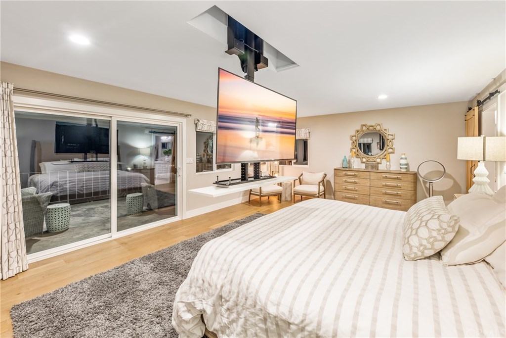 720 Sandpiper Drive Seal Beach, CA 90740 - Photo 17 of 69 A retractable TV descends from the ceiling in the master suite.