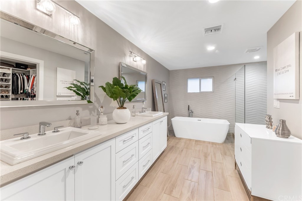 720 Sandpiper Drive Seal Beach, CA 90740 - Photo 21 of 69 Master bathroom. Complete with a soaking tub and a walk in shower.