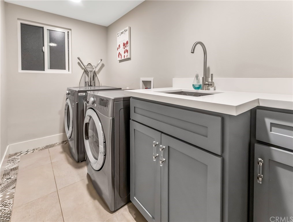 720 Sandpiper Drive Seal Beach, CA 90740 - Photo 35 of 69 Spacious laundry room is located on the main floor.
