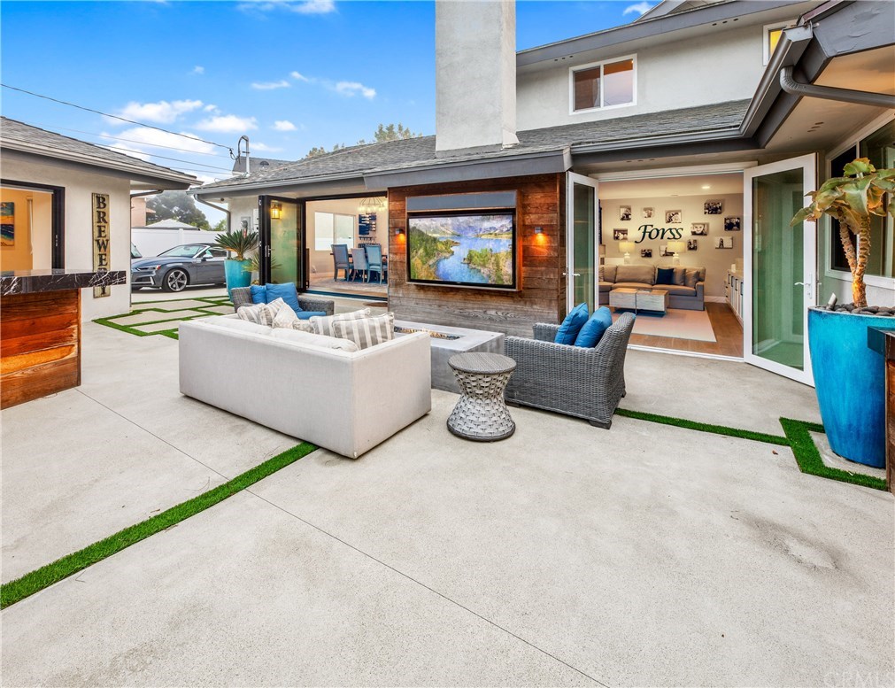 720 Sandpiper Drive Seal Beach, CA 90740 - Photo 51 of 69 Living room open, view from the backyard.
