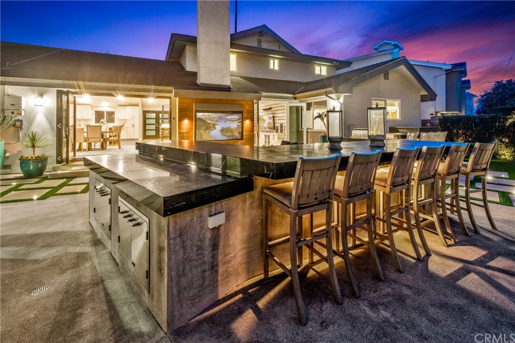 720 Sandpiper Drive Seal Beach, CA 90740 - Photo 53 of 69 Twilight at the L-Shaped granite topped bar / outdoor kitchen, meticulous hardscape, drop dead gorgeous outdoor gathering area.
Fit for a king!