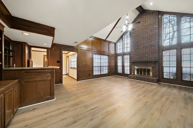 a view of an entryway with wooden floor