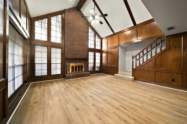 a view of an entryway with wooden floor
