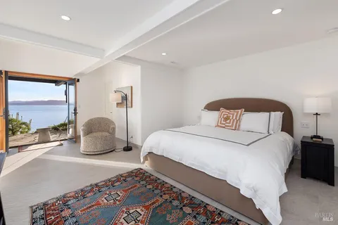 a view of balcony with wooden floor and a floor to ceiling window