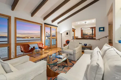 an aerial view of a house with garden space and street view