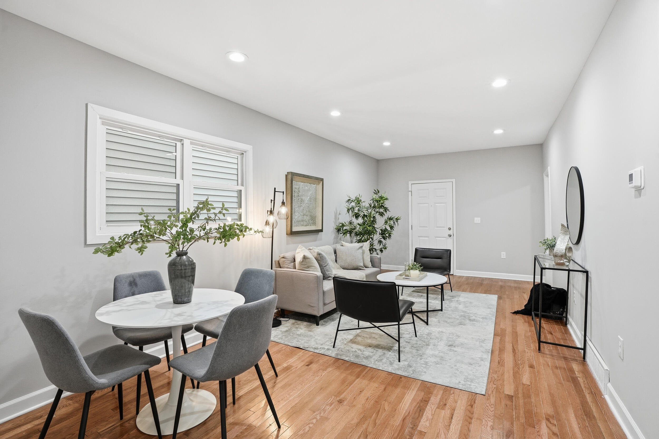 2406 Birch Avenue Whiting, IN 46394 - Photo 11 of 16 a dining room with furniture potted plants and wooden floor