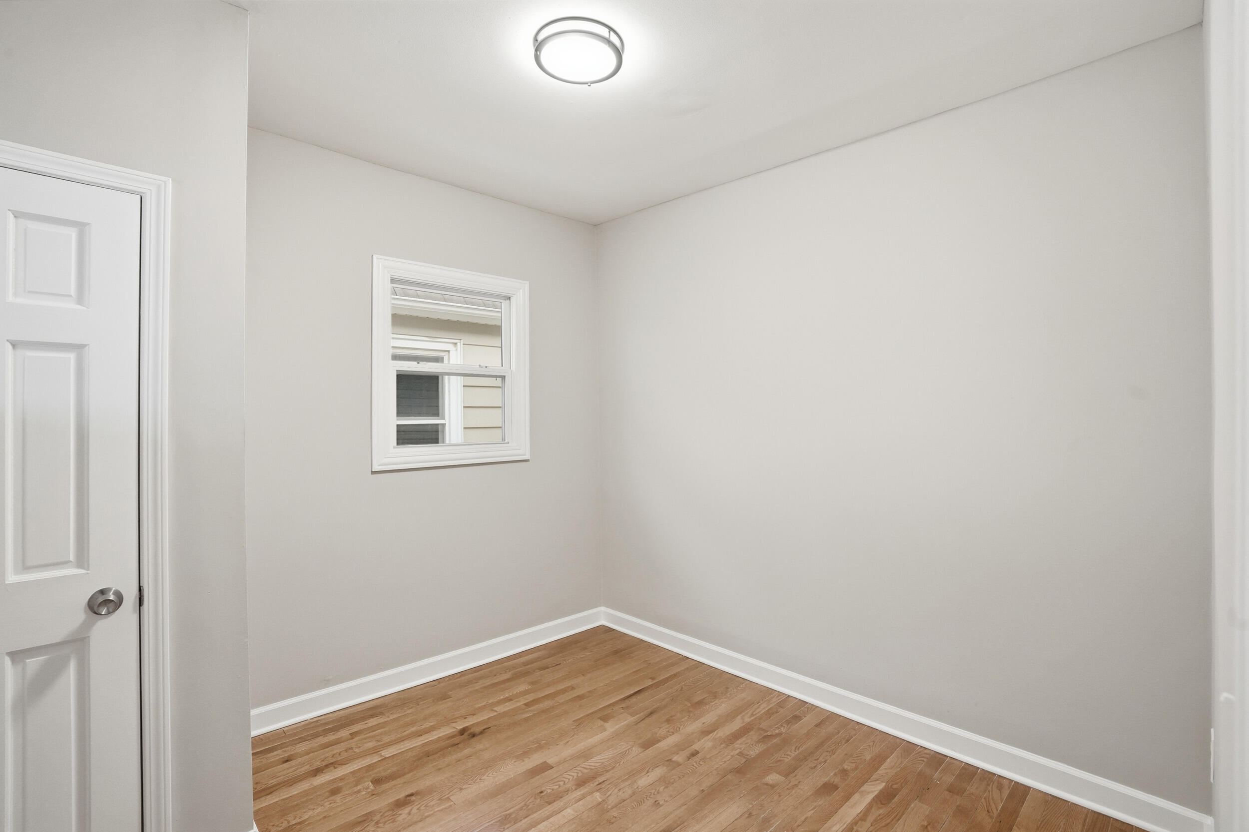 2406 Birch Avenue Whiting, IN 46394 - Photo 12 of 16 a view of a small space with wooden floor and a window
