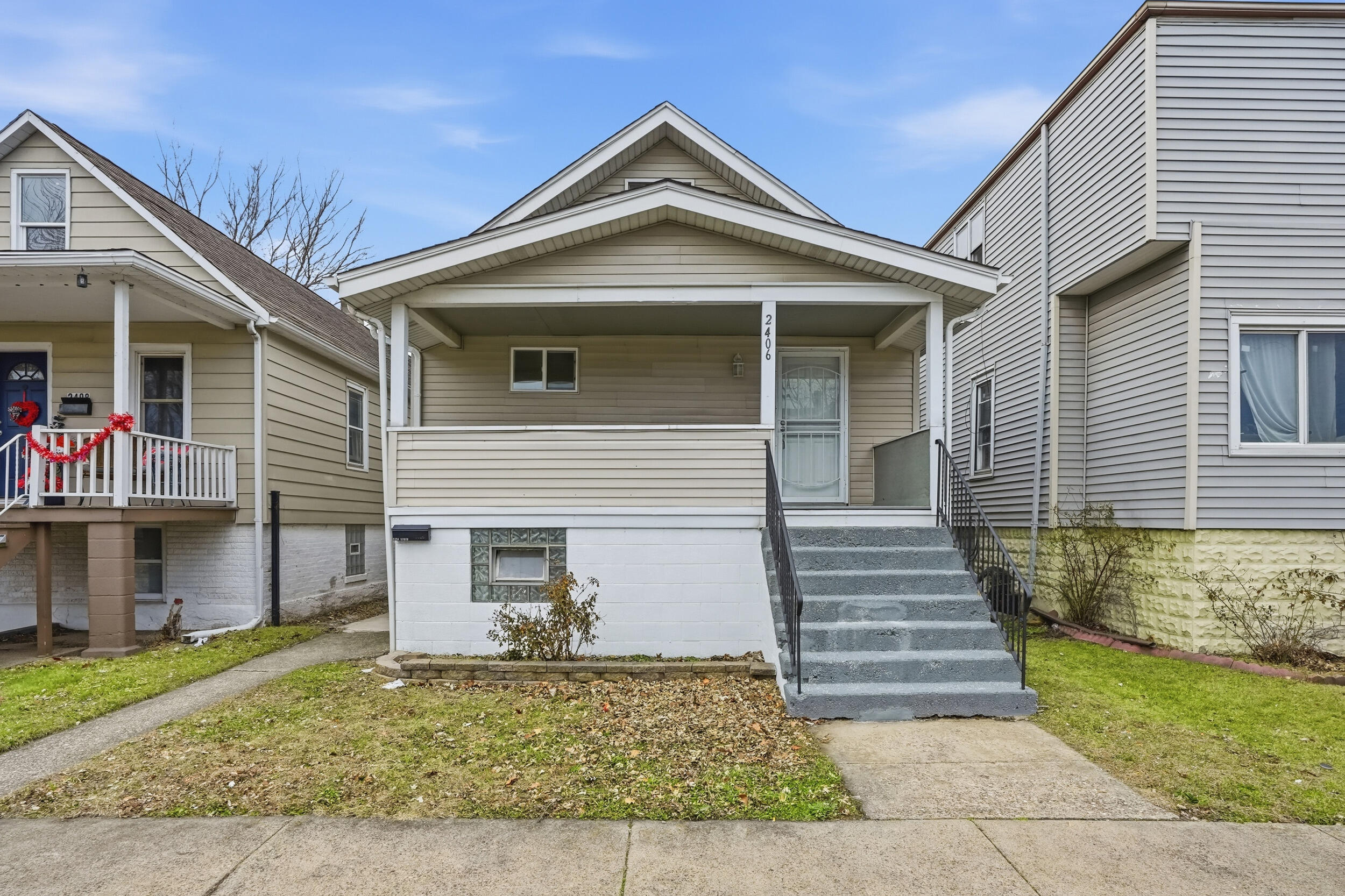 2406 Birch Avenue Whiting, IN 46394 - Photo 2 of 16 a front view of a house with a yard